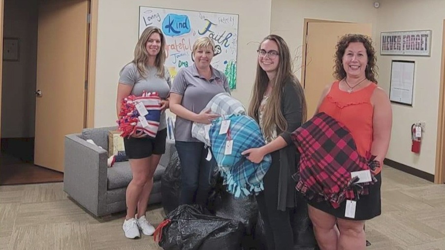 Suburban woman asking for blanket donations to keep the needy warm