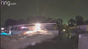 Floodwater halfway up a police cruiser