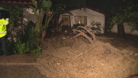 Mudslide slams into Encino home, others threatened