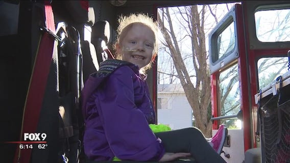 Girl fighting cancer rides in firetruck to surgery