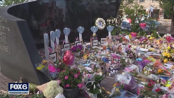 Biden celebration of new gun law clouded by Highland Park parade shooting