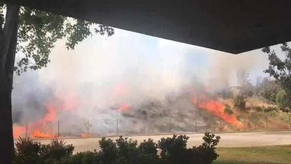 Firefighters working brush fire near Hwy 237 in Mountain View