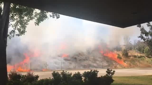 Firefighters working brush fire near Hwy 237 in Mountain View
