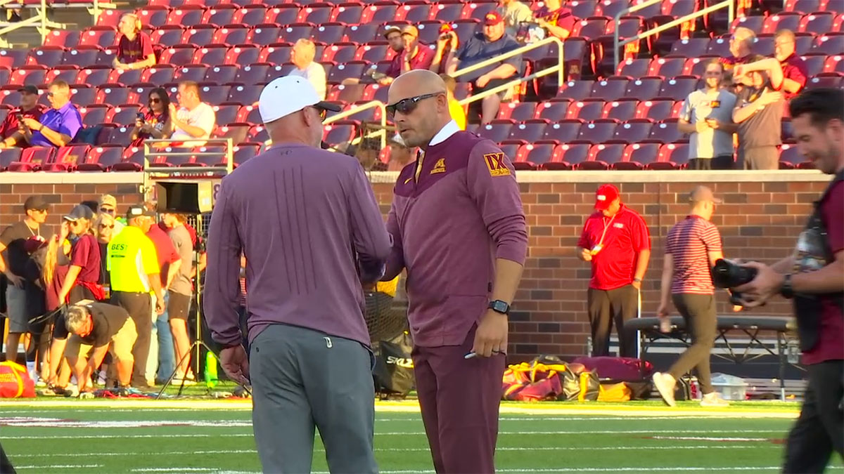 Gophers coach P.J. Fleck shake hands with Jerry Kill
