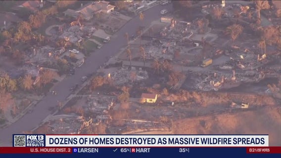 Dozens of homes destroyed as massive CA wildfire spreads