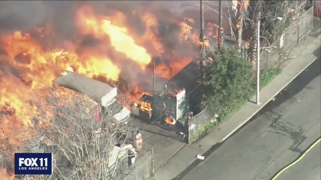 Several homes destroyed after massive fire breaks out at a Compton pallet yard