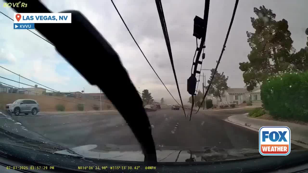 Power poles collapse onto cars on Las Vegas road