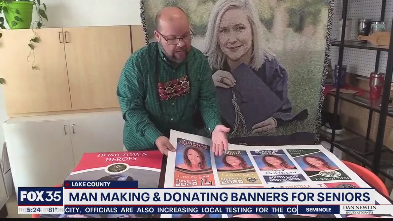Man making and donating banners for graduating seniors