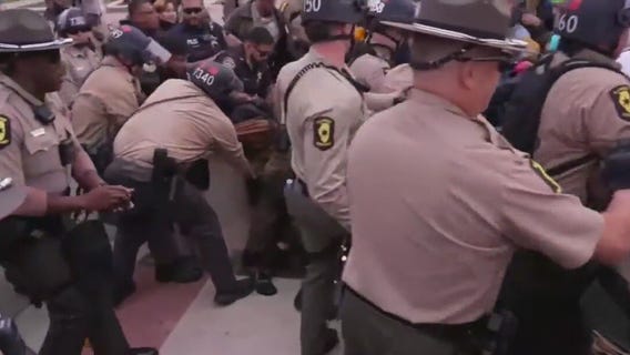 Chicago-area anti-ICE protestors clash with police at facility