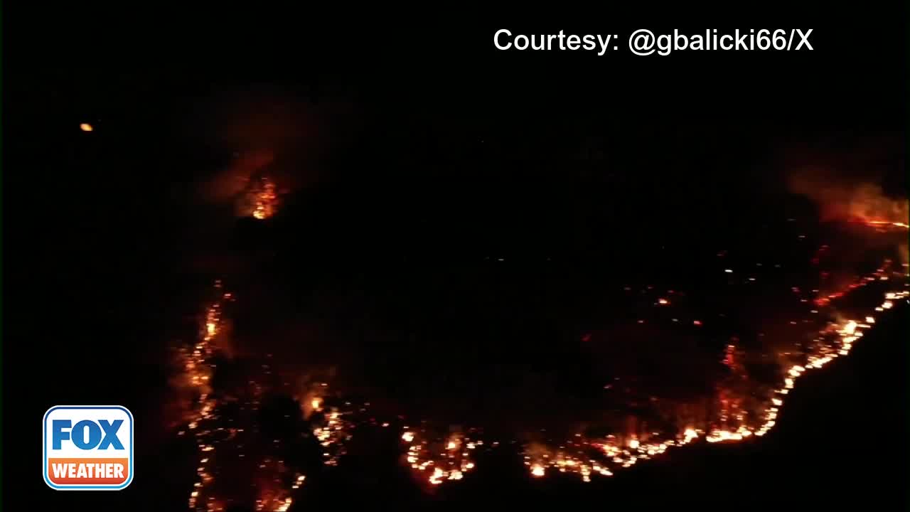 Large wildfire burns atop Connecticut mountain
