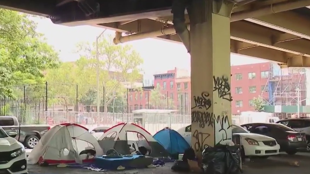 NYC migrants gather in tent encampments