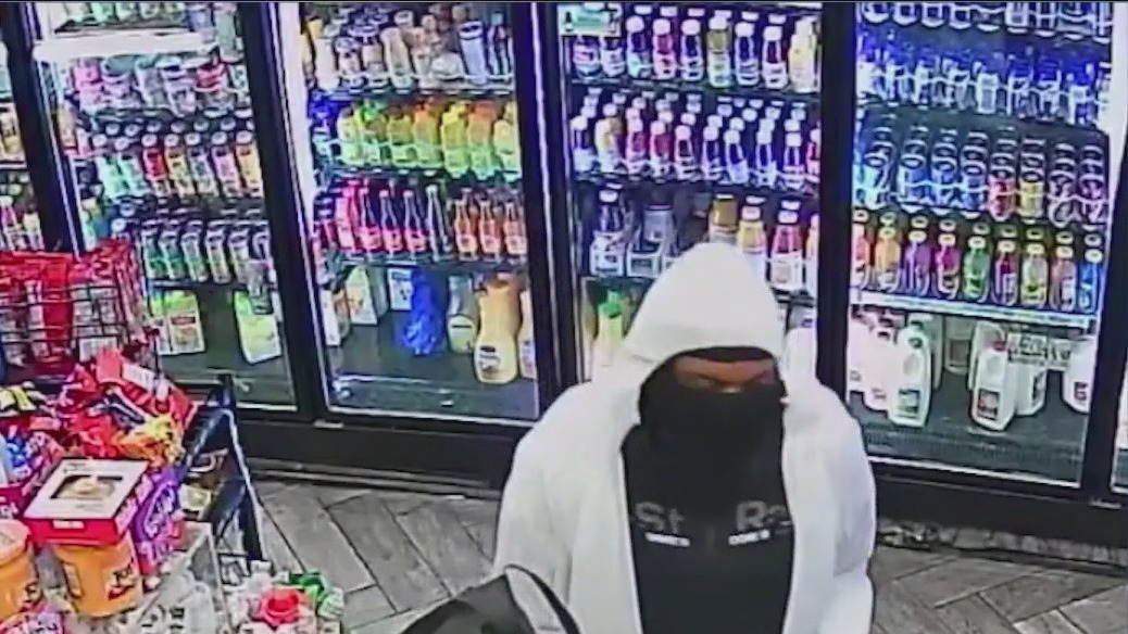 The Tyvek-suit wearing gunman has been arrested in the killing of a bodega worker