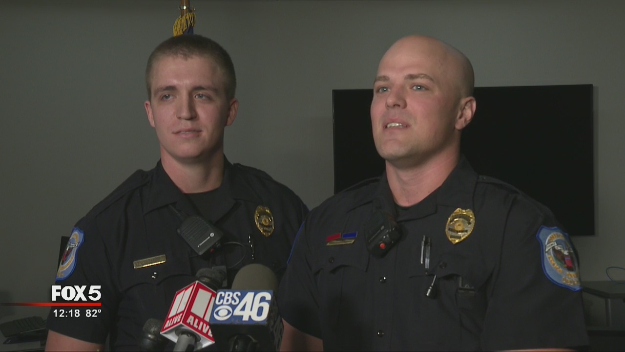 Officers pull man from car