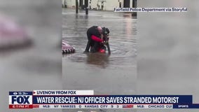 Police officer saves motorist from flood waters