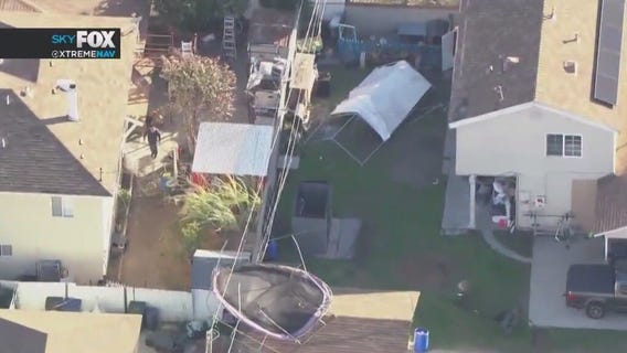 Trampoline stuck on top of powerline in Pico Rivera