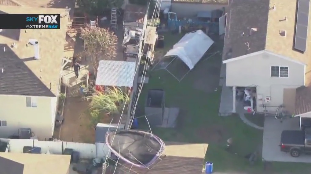 Trampoline stuck on top of powerline in Pico Rivera