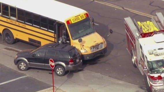 Driver hospitalized, no students hurt in school bus crash