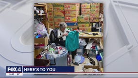 Volunteers assemble clothing packages for those in need