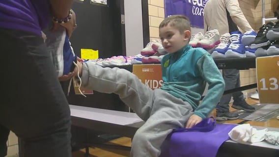 Kids in need getting new pairs of shoes