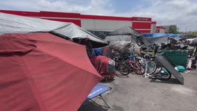 Newsom urges cities to ban homeless encampments
