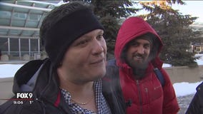 Fans arriving for Super Bowl hit with bitter cold