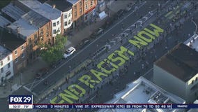 Hundreds paint 'End Racism Now' on Fishtown street