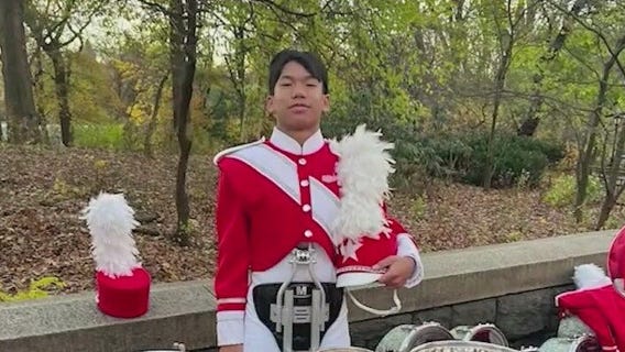 Student drummer marches in Macy's Thanksgiving Day Parade