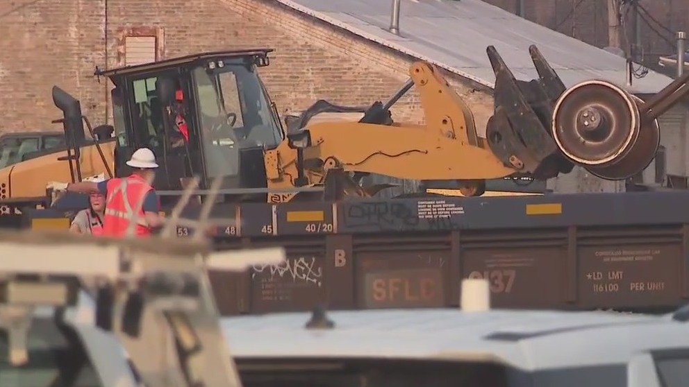 Metra BNSF trains stopped due to freight train derailment