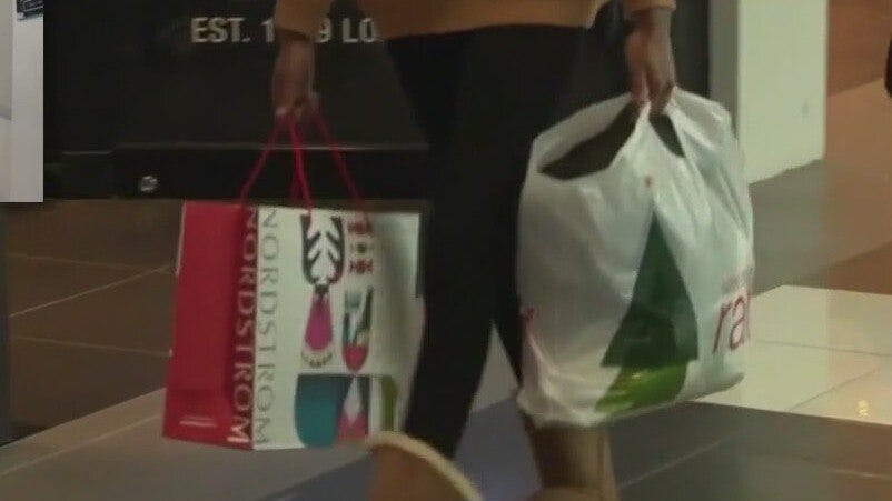 Holiday shoppers spending more this year than expected, data shows