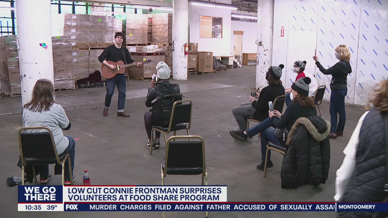 Local band's frontman surprises volunteers at food share program