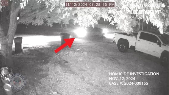 Surveillance video shows persons of interest's car 1 year after murder