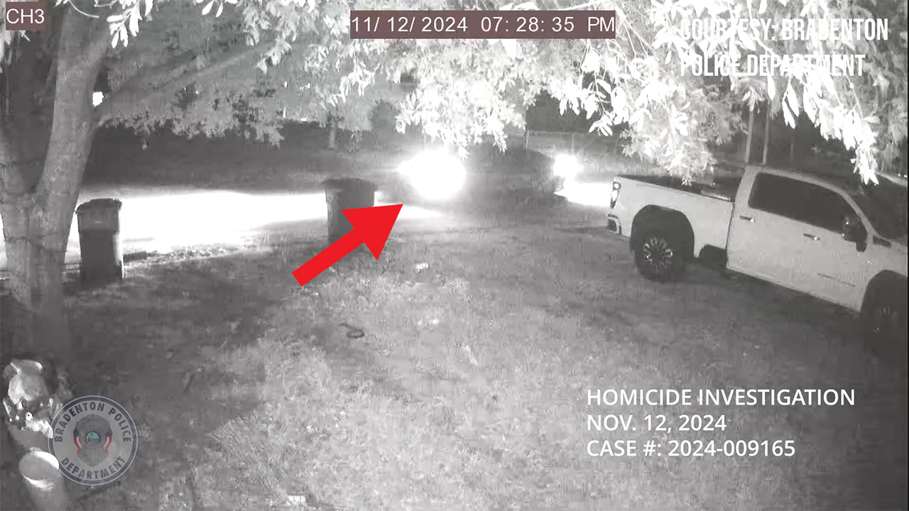 Surveillance video shows persons of interest's car 1 year after murder