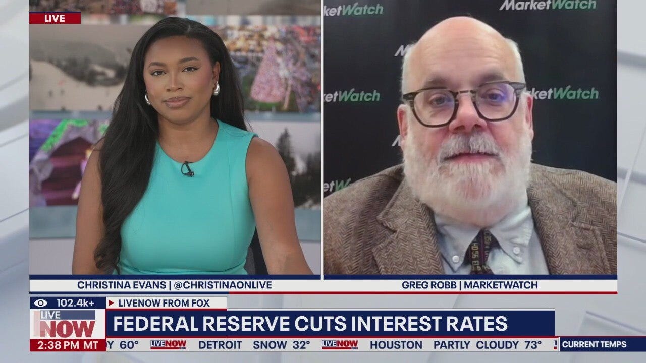 Fed cuts interest rates in divisive vote