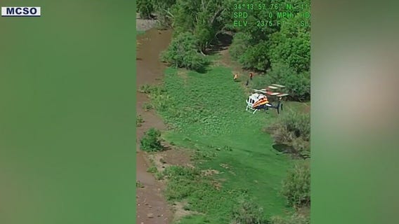 7 people stuck on canoes rescued during flash flooding