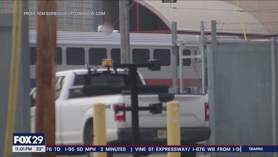 Dramatic rescue on train tracks as injured man found atop double-decker train