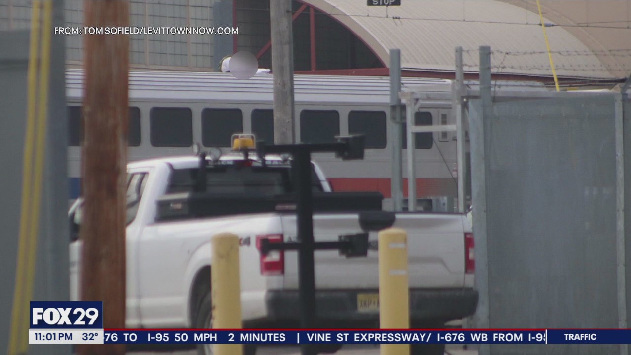 Dramatic rescue on train tracks as injured man found atop double-decker train