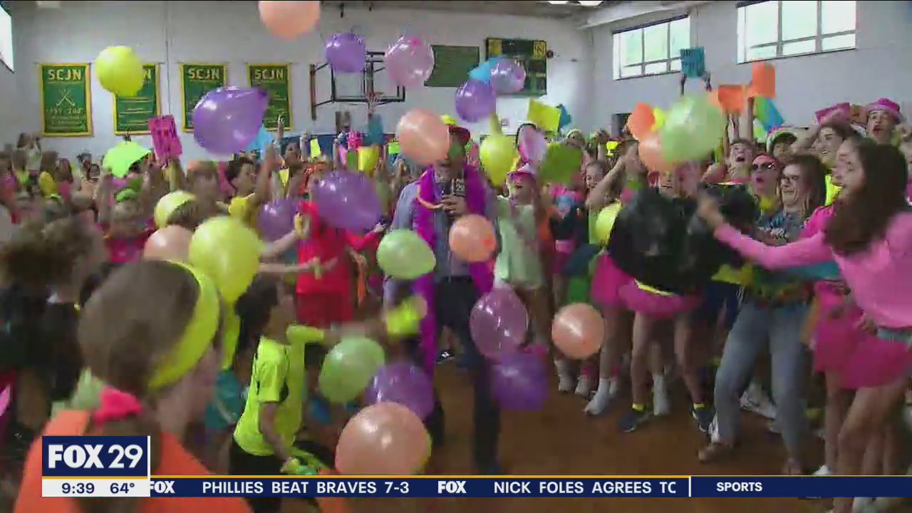 Local students celebrate with neon dance party