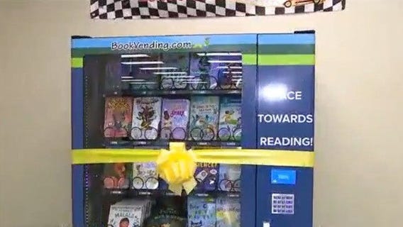 NASCAR driver donating book vending machine