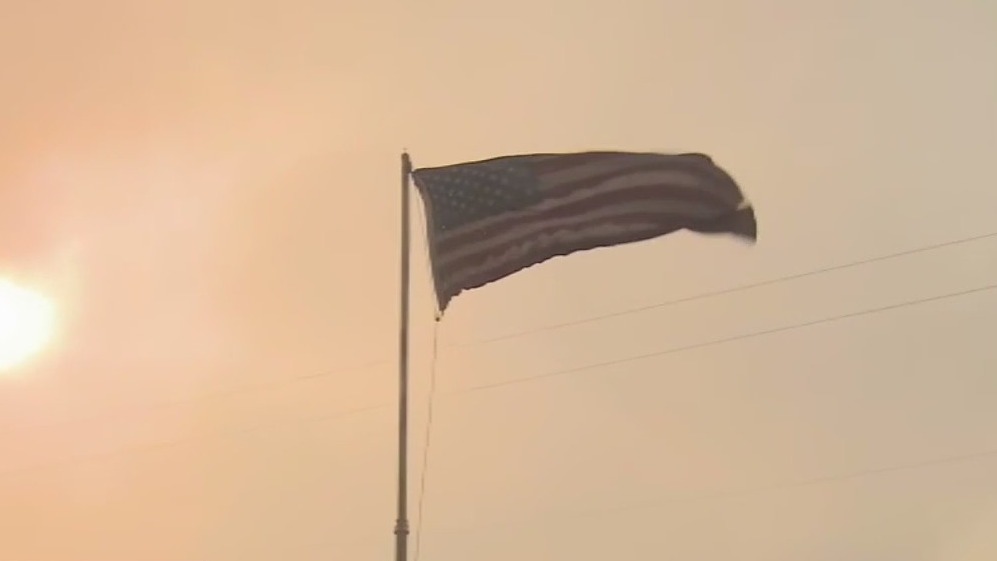 American flag stands strong amid wildfires