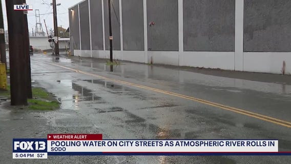 Pooling water on Seattle streets as atmospheric river rolls in