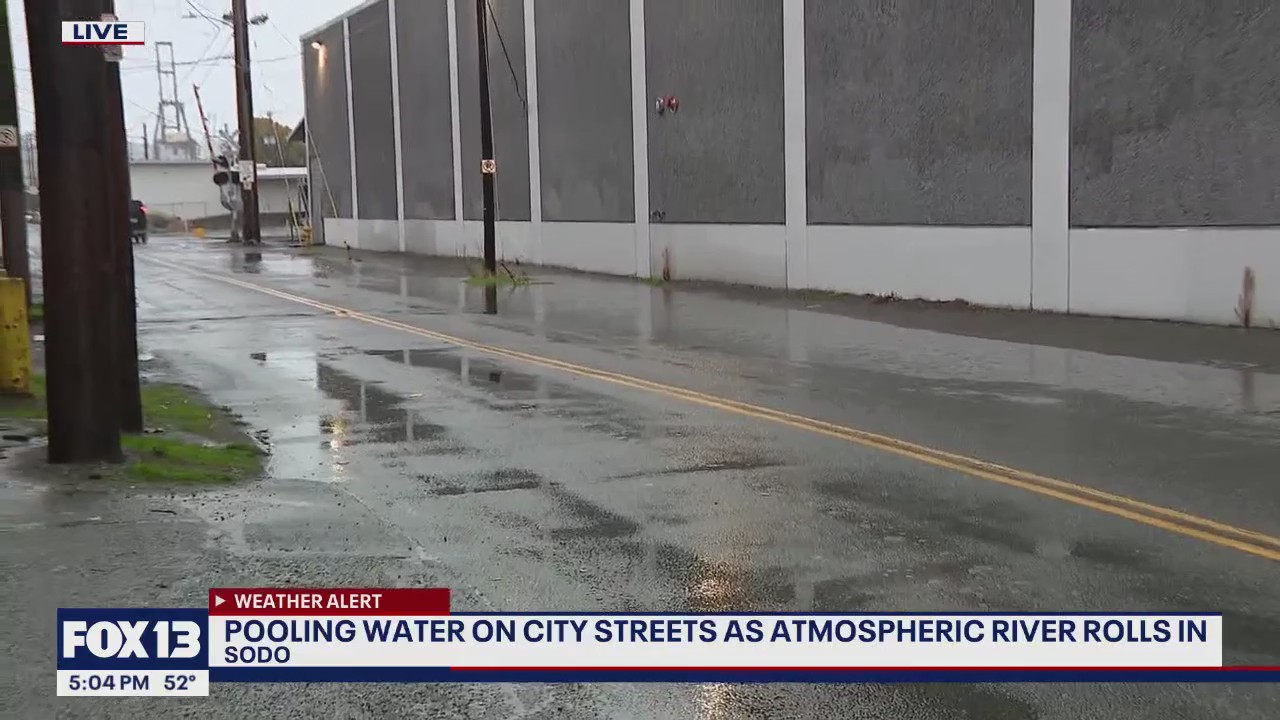 Pooling water on Seattle streets as atmospheric river rolls in