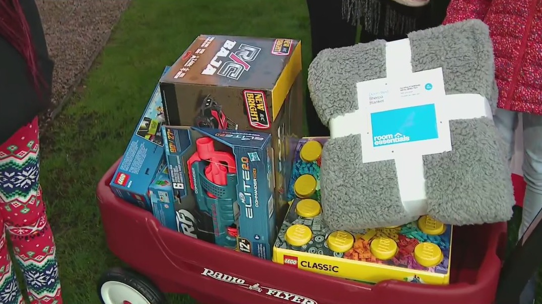 Volunteers drop off donated holiday gifts to children at Phoenix Children's Hospital