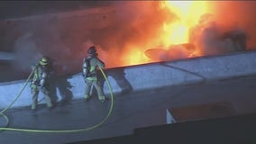 Strip mall fire erupts in Downey