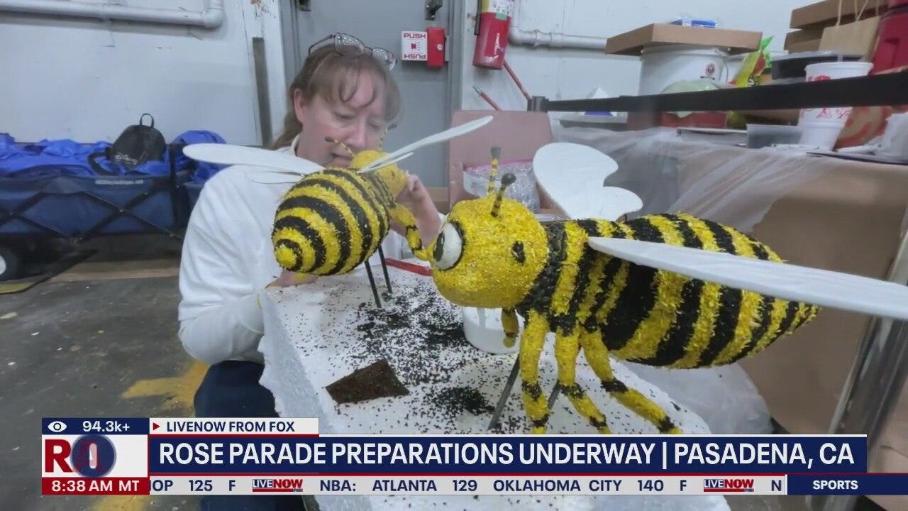 Volunteers decorate Rose Parade floats in Pasadena
