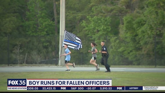 Boy runs for fallen police officers