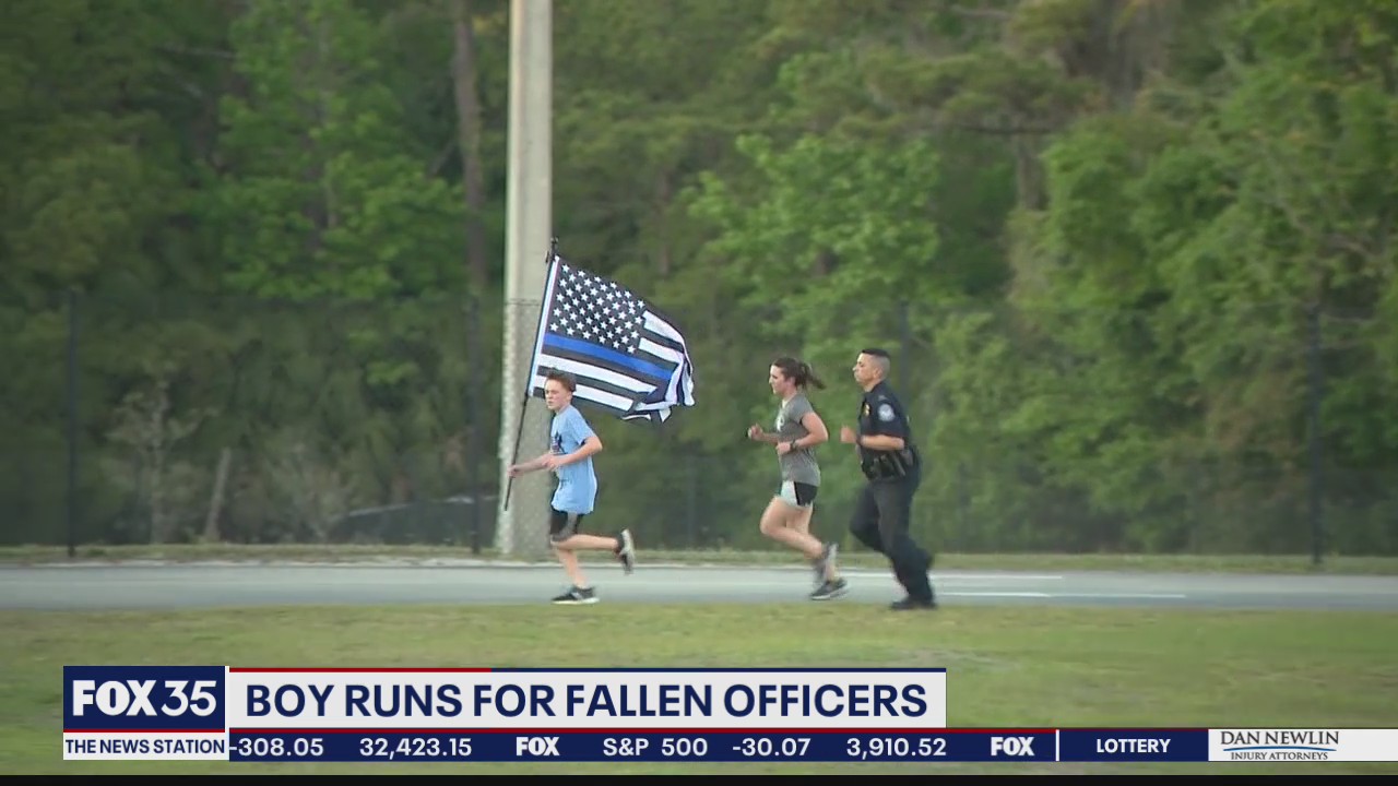 Boy runs for fallen police officers