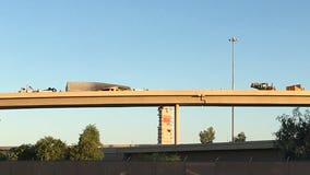 Semi-truck carrying produce flips on its side along I-10 ramp