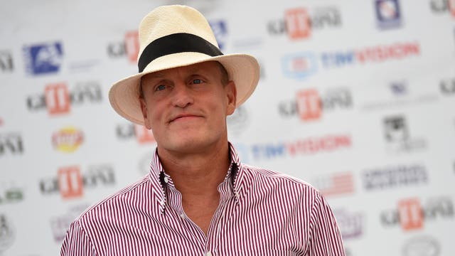 Woody Harrelson says he had to 'go outside and burn one' to get through dinner with Donald Trump
