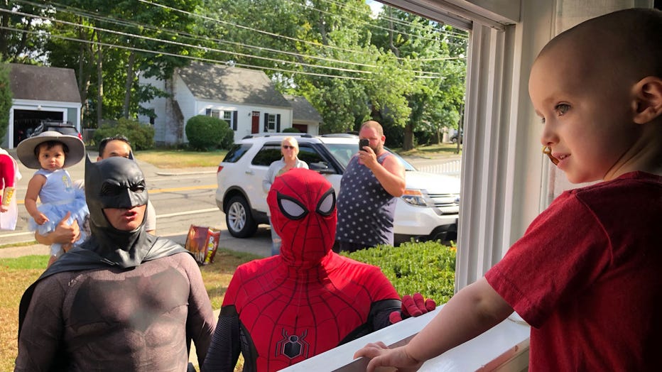 Superheroes, including Batman and Spiderman, arrive outside of Quinn Waters’ window on Aug. 25, 2019. (Photo credit: The Mighty Quinn / Facebook)
