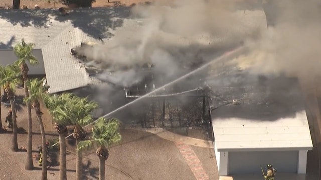 Firefighters battle fire at vacant home in Mesa